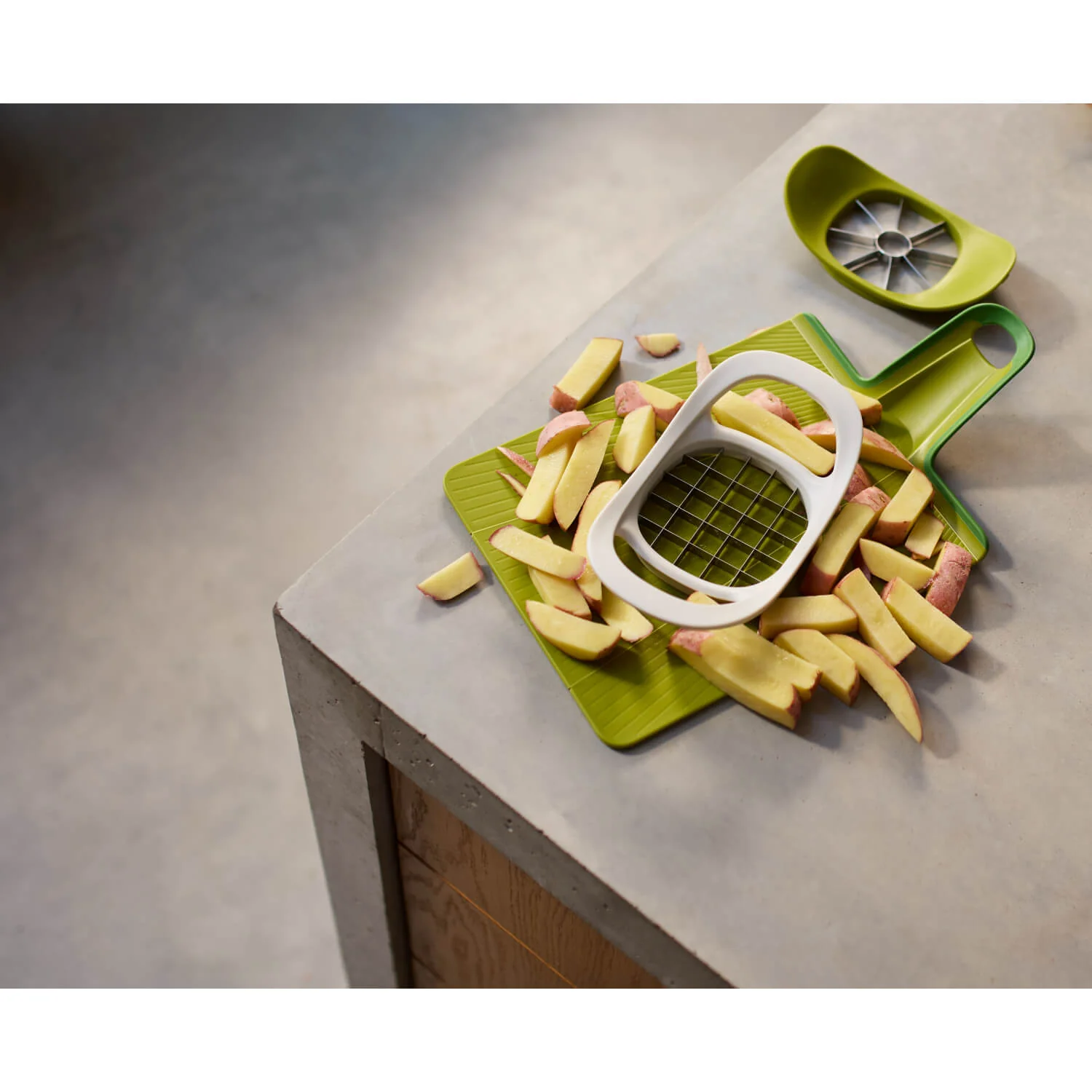 Joseph Joseph Nest™ Press 2-In-1 Fruit & Vegetable Cutter - Image 9